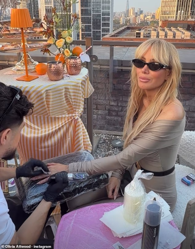 Olivia Attwood gets a tattoo on her ring finger after posting about her 'up and down year' on Instagram on Friday following ex Bradley Dack's outing with new romance