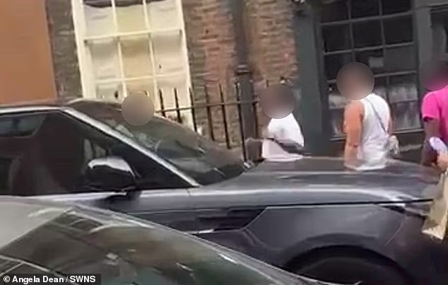 A video from the Soho street showed an altercation taking place behind a car