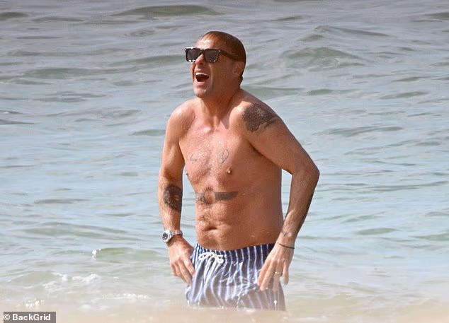 Ant McPartlin showed off his tattooed physique as he enjoyed a family getaway in Portugal with his wife Anne-Marie Corbett on Saturday