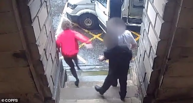 CCTV footage showed the moment Strachan broke free as two guards walked him towards the police van