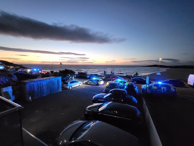 Coastguard at the scene at Fistral last night after a father and daughter died in the water