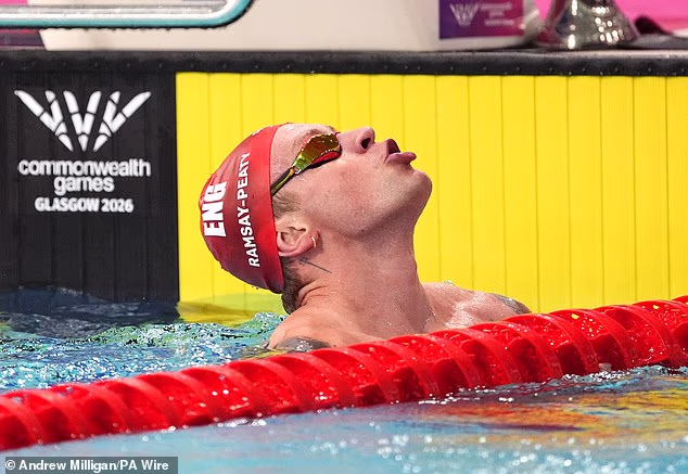 Adam Ramsay-Peaty reacts after winning bronze in the men's 50m breaststroke at the Commonwealth Games