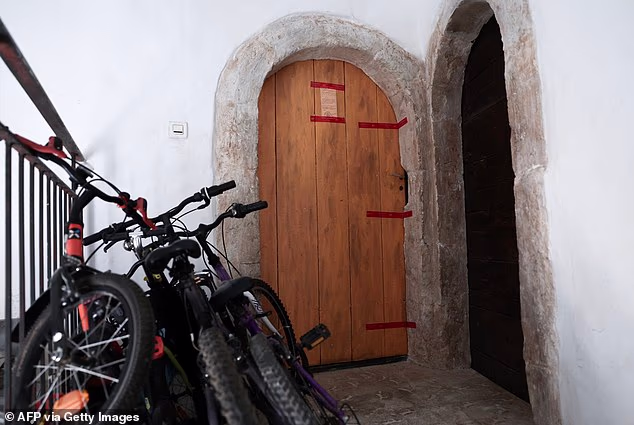 French police seals affixed to the door of an appartment in Orange, southern France, on July 28, 2026, after the bodies of five deceased infants were discovered