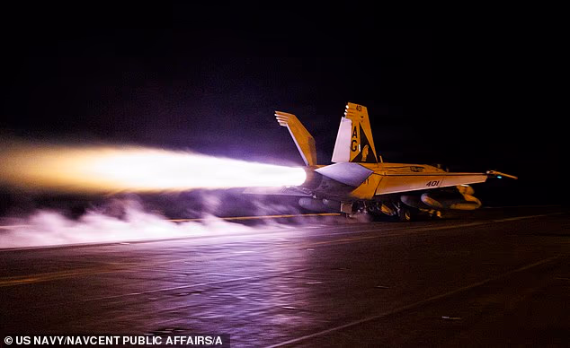 A United States F/A-18E Super Hornet fighter jet takes off from an aircraft carrier on July 21