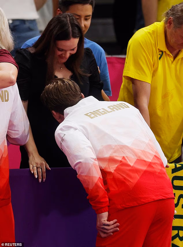 Adam Peaty kissed his pregnant wife Holly Ramsay's baby bump as he celebrated winning a silver medal for the 4x100m medley relay at the Commonwealth Games on Wednesday