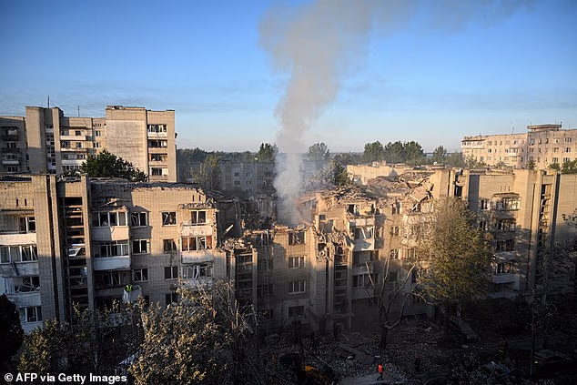 First responders operate at a residential building partially destroyed as a result of Russian missile strikes in the western Ukrainian city of Lviv on July 30, 2026, amid the Russian invasion in Ukraine