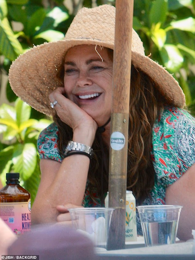 Kathy Ireland, Sports Illustrated pinup turned branding mogul, was all smiles dining with her family in the affluent enclave of Montecito, California earlier this week - despite being embroiled in a lawsuit against her longtime Hollywood managers