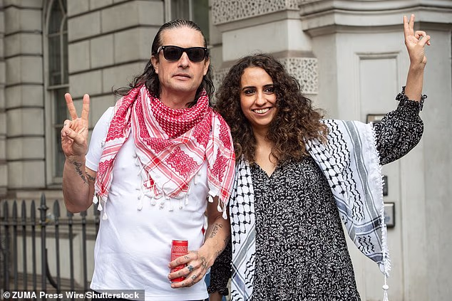 Huda Ammori (right) with Palestine Action co-founder Richard Barnard, pictured in 2024, has been granted the green light to challenge the group's prohibition in the Supreme Court