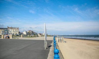 Two men die after going into sea to rescue children