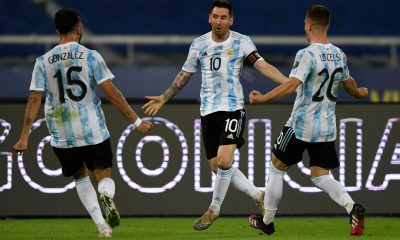 Argentina's Lionel Messi (C) celebrates with teammates Nicolas Gonzalez (L) and Giovani Lo Celso