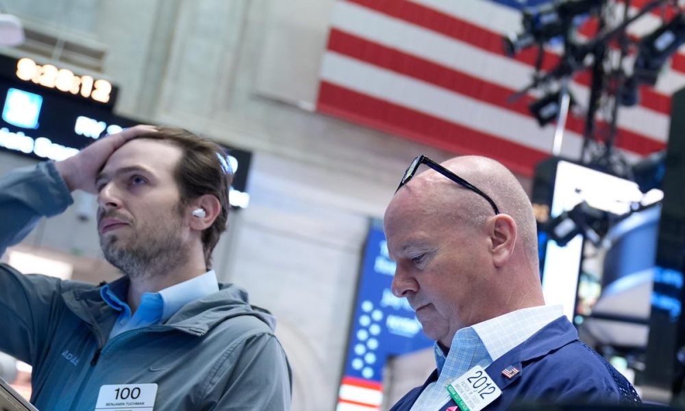 Wall Street falls as investors digest tech earnings
