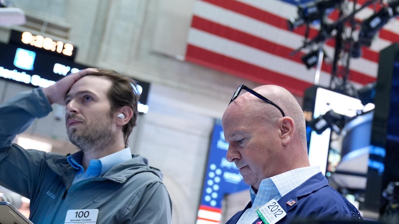 Wall Street falls as investors digest tech earnings