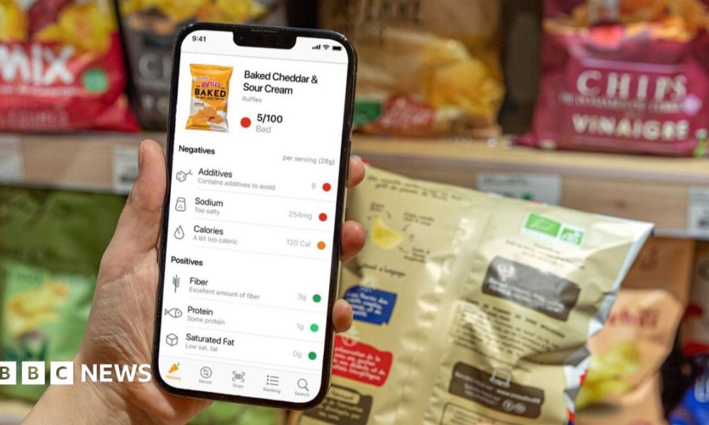 Nathalie uses her phone to scan a product.