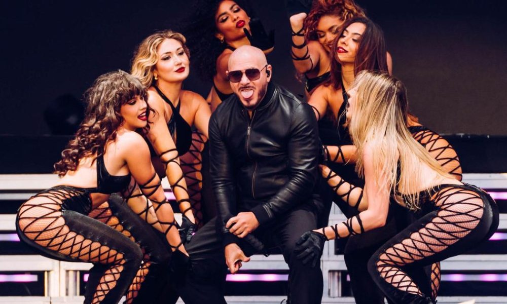 Pitbull closes Lytham Festival as thousands wear bald caps