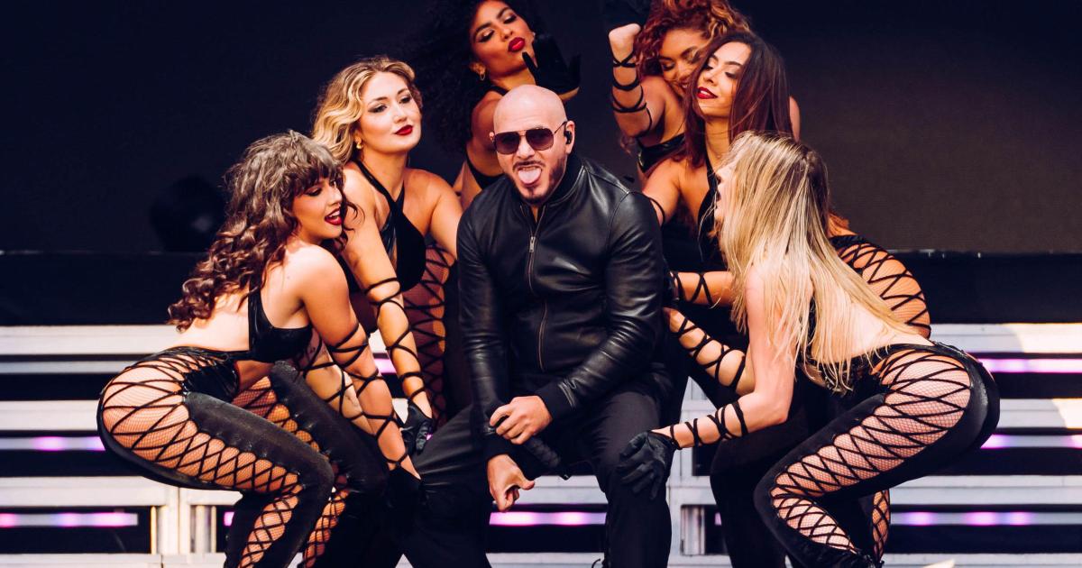 Pitbull closes Lytham Festival as thousands wear bald caps