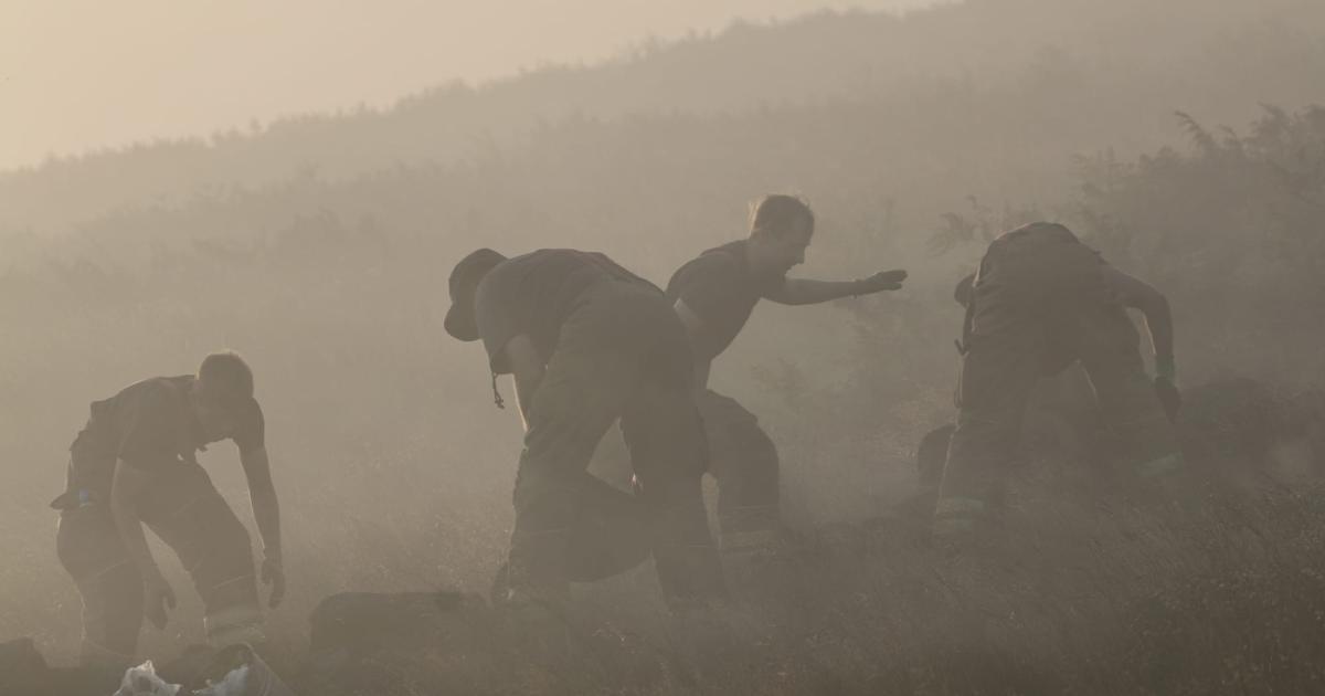 Firefighters could remain at Woodhead Pass until Sunday
