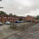Man charged after Bolton roof incident on Centenary Court