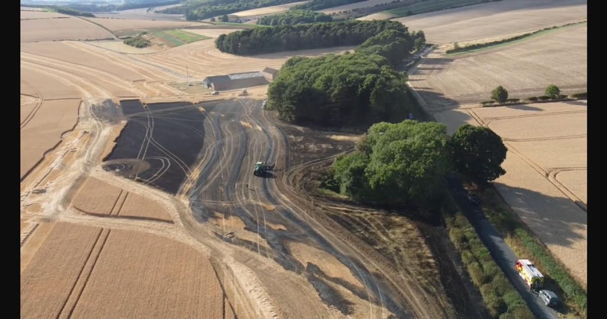 Emergency services at scene of field fire near Malton