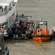 Rescue boats and a Met Police boat next to each other in the Thames.