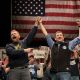 Graham Platner and Troy Jackson stand together during a “Fighting Oligarchy” tour stop on May 24, 2026, in Orono, Maine.