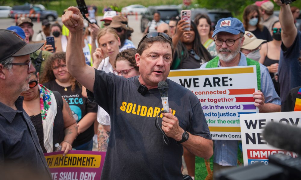 Troy Jackson, Democratic candidate for U.S. Senate, speaks during a demonstration outside of a federal immigration office on July 14, 2026, in Scarborough, Maine.
