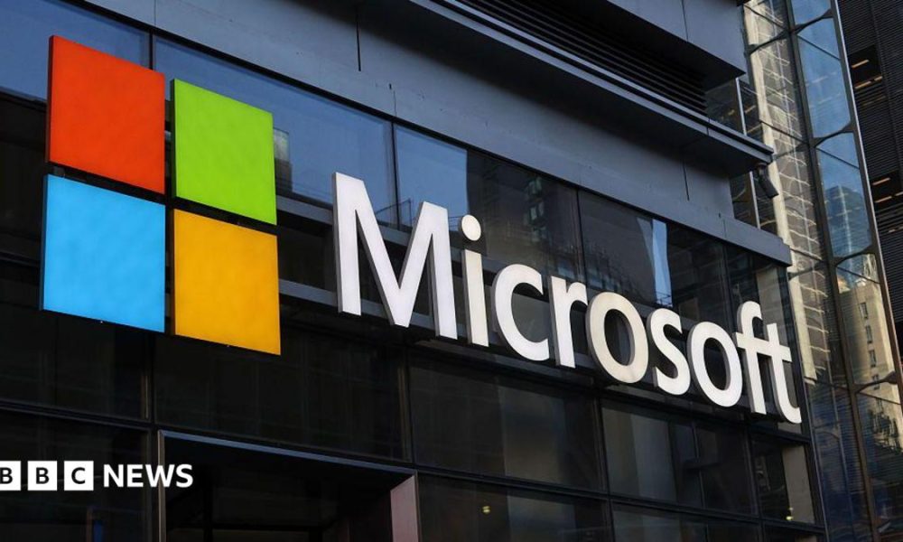A Microsoft building with a sign bearing the company's logo