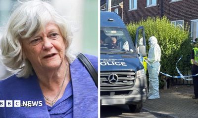 Ann Widdecombe smiles as she looks to the right. She is wearing a blue blazer and a flowery blue and white top.