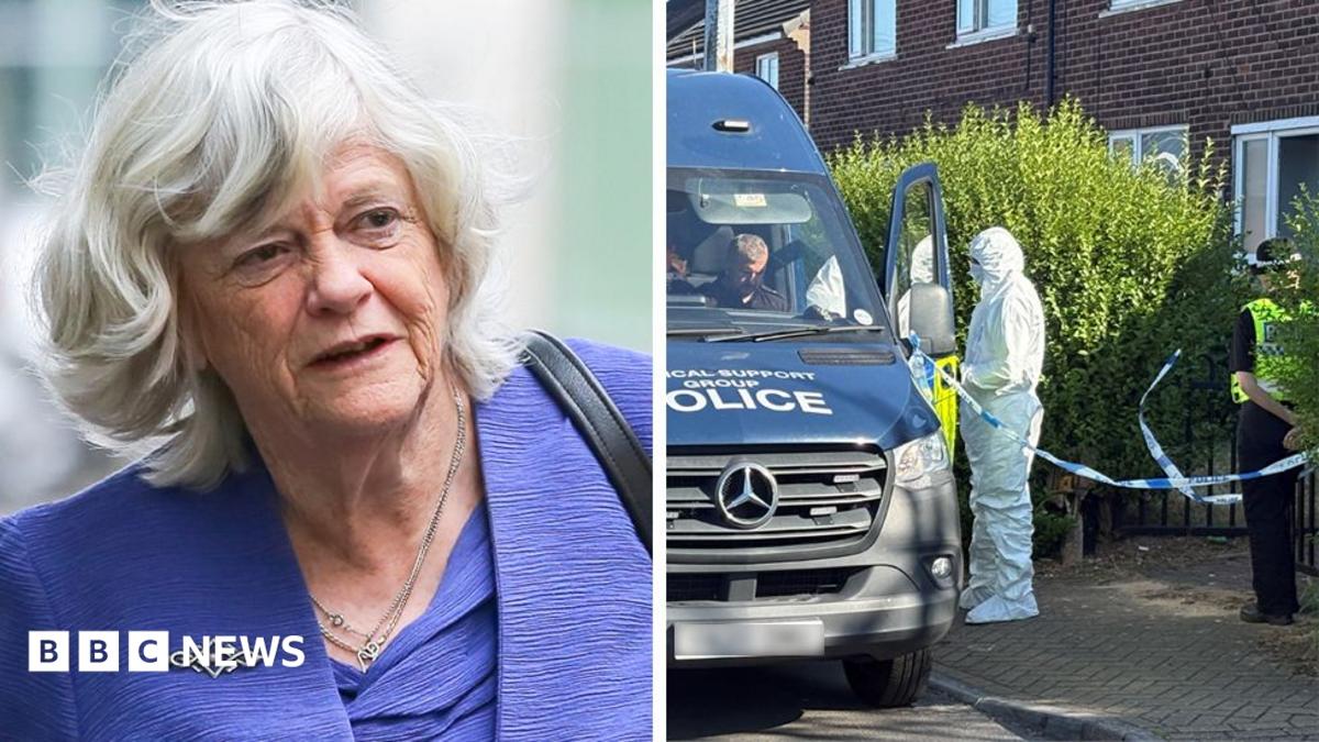 Ann Widdecombe smiles as she looks to the right. She is wearing a blue blazer and a flowery blue and white top.