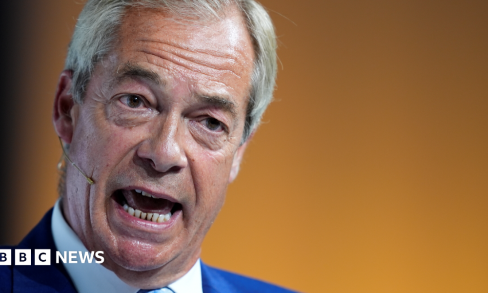 Reform UK leader Nigel Farage speaking during a conference at Olympia London in June 2026.