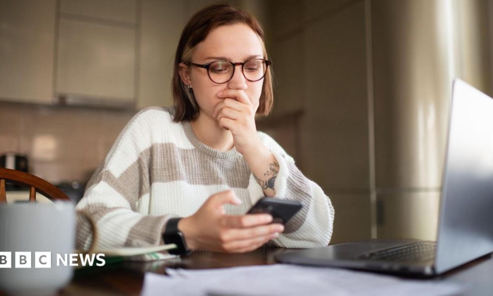 Two young women surrounded by studio lights and tripods selling eyelash serums on a live stream