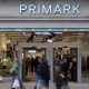 Shoppers, not in focus, walk past a Primark store in London