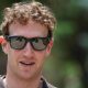 Meta CEO Mark Zuckerberg walking outside wearing a polo-style shirt and a pair of his company's camera-enabled sunglasses.