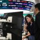 Currency dealers watch monitors as an electronic screen shows South Korea's benchmark stock index (KOSPI) in a foreign exchange dealing room at the Hana Bank headquarters in Seoul on July 28.