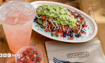 A chicken bowl from Chipotle with a drink and a dip.