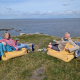 The author (left) having a cup of tea on the edge of a cliff.