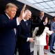 U.S. President Donald Trump waves at crowds with FIFA President Gianni Infantino during the FIFA World Cup 2026 Final on Sunday.