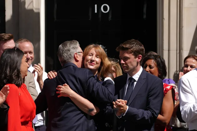 Britain's outgoing Prime Minister Keir Starmer hugs Rachel reeves as he leaves 10 Downing Street in London, Monday, July 20, 2026.(AP Photo/Kirsty Wigglesworth)