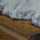 Firefighters work to suppress a fire near Ares, during wildfires in the area of southwestern France, Tuesday, July 28, 2026.