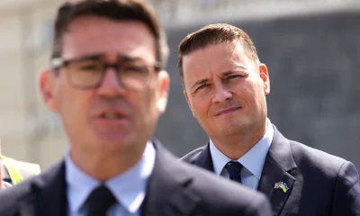 British Prime Minister Andy Burnham, foreground, and Defence Secretary Wes Streeting, right