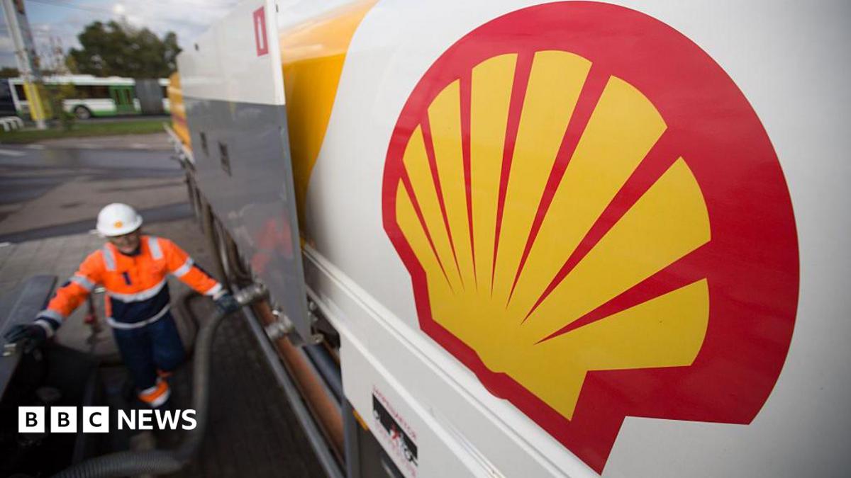 The Shell logo on a new fuel tanker truck as it delivers petrol to a gas station