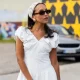 COPENHAGEN, DENMARK - AUGUST 05: A guest wears white dress, head bag, bag outside Rolf Ekroth during the Copenhagen Fashion Week (CPHFW) SS25 on August 05, 2024 in Copenhagen, Denmark. (Photo by Christian Vierig/Getty Images)