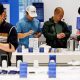 Customers try Samsung smartphones at one of the company's stores in Seoul