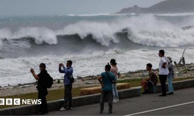 Residents observe huge waves brought by Typhoon Bavi in Hualien city, Taiwan