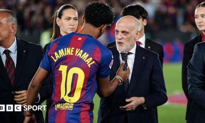 Lamine Yamal of Barcelona shakes hands with Javier Tebas, the president of La Liga