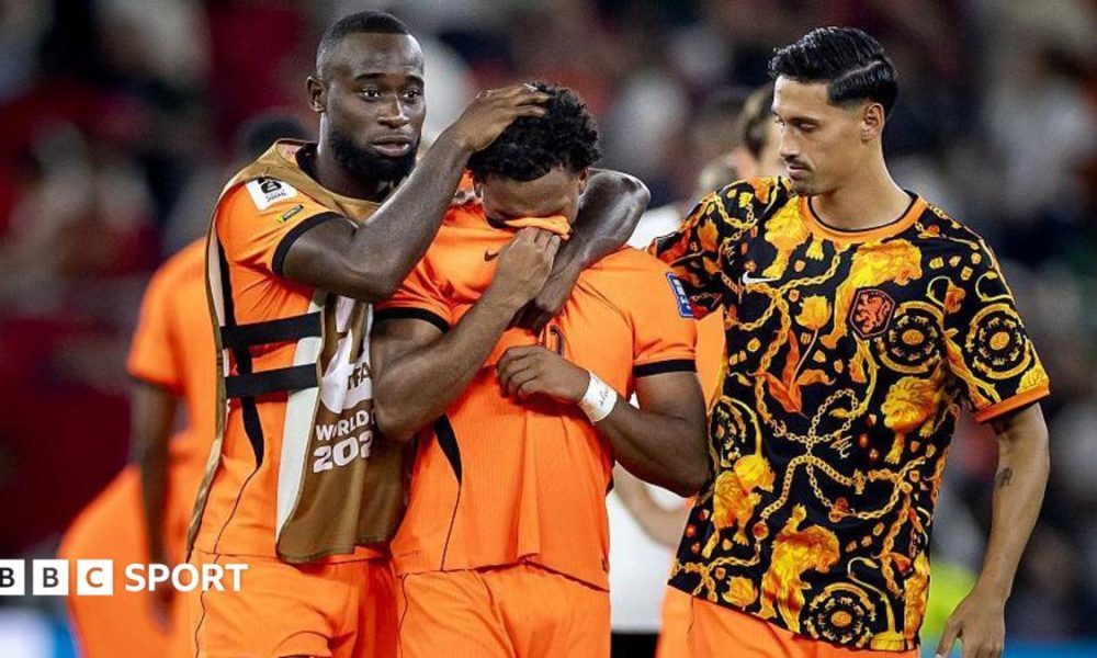 Justin Kluivert is consoled after he missed a penalty for the Netherlands in the penalty shootout against Morocco