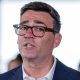 Andy Burnham in a suit and glasses. A close up of his face.