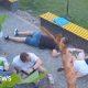 At least six people crouched on the floor as they take shelter from attack neaby