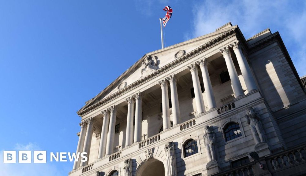 The front of the Bank of England building - a triangular roof is held up by multiple columns, and there is an arched entrance