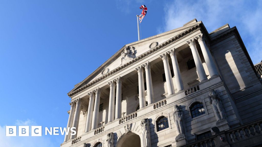 The front of the Bank of England building - a triangular roof is held up by multiple columns, and there is an arched entrance