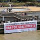 Campaigners display a banner reading UK Government Keep Your Promise Ban Foie Gras Imports